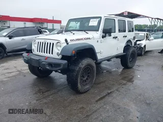 2014 Jeep Wrangler Unlimited Rubicon with VIN 1C4HJWFG4EL104827, listed as a IAAI auction lot 42236622 with 90,935 mi miles and . Bid and sale history available at DreamBid. Image 19.