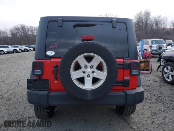 2015 Jeep Wrangler Willys Wheeler with VIN 1C4AJWAG9FL543998, listed as a Copart auction lot 88947025 with 142,433 mi miles and Salvage title. Bid and sale history available at DreamBid. Image 6.