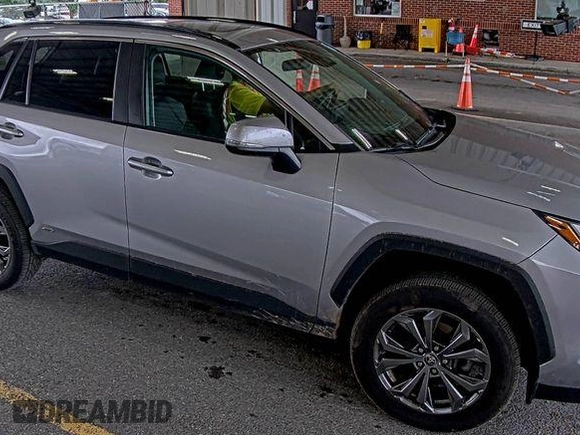 2022 Toyota RAV4 Hybrid XLE Premium with VIN 4T3B6RFV2NU084419, listed as a IAAI auction lot 42729518 with 76,607 mi miles and . Bid and sale history available at DreamBid. Image 2.