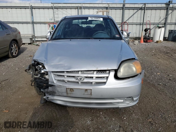 2005 Hyundai Accent GLS with VIN KMHCG45C05U618580, listed as a Copart auction lot 79239064 with 54,228 mi miles and Salvage Title. Bid and sale history available at carsss.com. Image 5.