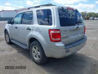 2009 Ford Escape Hybrid with VIN 1FMCU593X9KA36061, listed as a IAAI auction lot 42060150 with 183,184 mi miles. Bid and sale history available at carsss.com. Image 3.