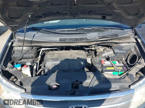 2012 Honda Odyssey EX-L with VIN 5FNRL5H6XCB061026, listed as a IAAI auction lot 42574612 with 144,480 mi miles and . Bid and sale history available at DreamBid. Image 10.