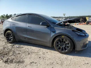 2023 Tesla Model Y Long Range z VIN 7SAYGDEE7PA199067, wystawiony jako Copart lot #52463215 z przebiegiem 30 978 mil mil oraz Szkoda całkowita • Salvage title. Historia ofert i sprzedaży dostępna na DreamBid. Obrazek 4.