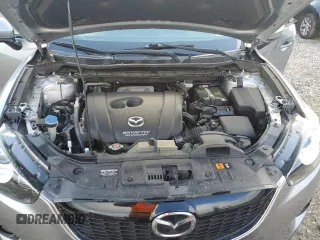 2014 Mazda CX-5 Touring z VIN JM3KE2CY0E0412733, wystawiony jako Copart lot #55803865 z przebiegiem 161 539 mil mil oraz Szkoda całkowita • Salvage title. Historia ofert i sprzedaży dostępna na DreamBid. Obrazek 12.