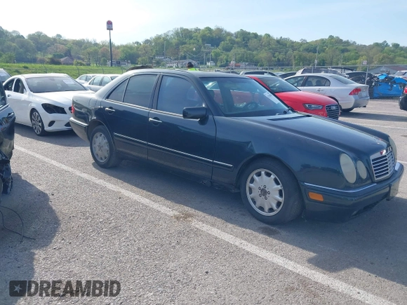 1997 Mercedes-Benz E-Class with VIN WDBJF55F7VJ027080, listed as a IAAI auction lot 42120838 with 150,197 mi miles. Bid and sale history available at carsss.com. Image 1.