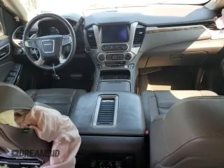 2015 GMC Yukon Denali with VIN 1GKS2CKJ3FR663324, listed as a Copart auction lot 70306614 with 154,234 mi miles and Salvage Title. Bid and sale history available at carsss.com. Image 8.