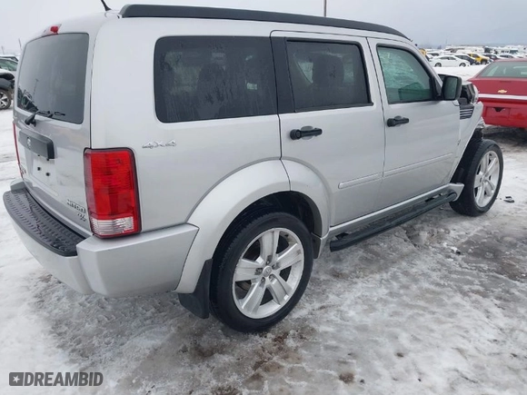 2011 Dodge Nitro Heat with VIN 1D4PU4GX1BW607458, listed as a IAAI auction lot 41279270 with 90,969 mi miles. Bid and sale history available at carsss.com. Image 4.
