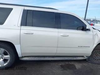 2015 Chevrolet Suburban LT with VIN 1GNSKJKC0FR309866, listed as a IAAI auction lot 41743848 with 220,778 mi miles and . Bid and sale history available at DreamBid. Image 13.