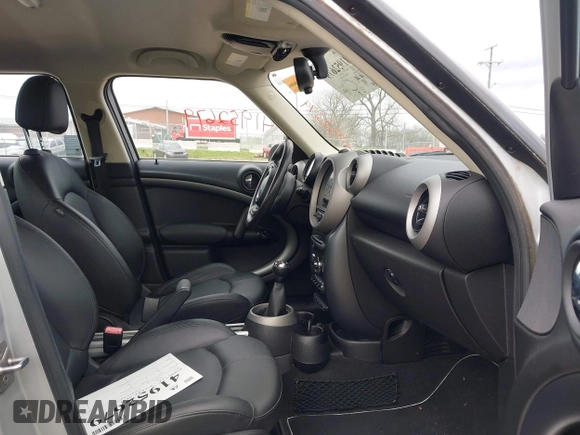 2011 MINI Countryman S with VIN WMWZC5C51BWM10385, listed as a IAAI auction lot 41952679 with 112,008 mi miles and . Bid and sale history available at DreamBid. Image 5.