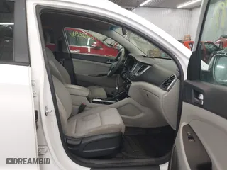 2016 Hyundai Tucson SE with VIN KM8J33A48GU117807, listed as a IAAI auction lot 41642891 with 142,371 mi miles. Bid and sale history available at carsss.com. Image 5.