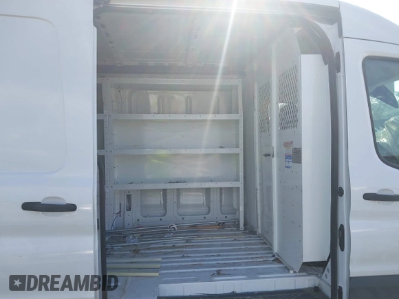 2023 Ford Transit Cargo z VIN 1FTBR1C85PKB34166, wystawiony jako IAAI lot #42216076 z przebiegiem 62 442 mil mil oraz . Historia ofert i sprzedaży dostępna na DreamBid. Obrazek 8.