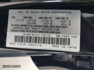 2014 Mazda Mazda3 s Grand Touring with VIN JM1BM1M31E1150126, listed as a IAAI auction lot 41813519 with 103,578 mi miles. Bid and sale history available at carsss.com. Image 9.