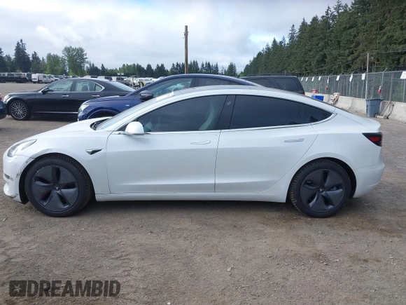 2020 Tesla Model 3 Standard Range Plus with VIN 5YJ3E1EA5LF613002, listed as a IAAI auction lot 42129085 with 55,672 mi miles. Bid and sale history available at carsss.com. Image 15.