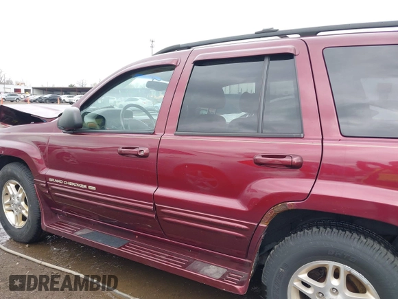 1999 Jeep Grand Cherokee Limited with VIN 1J4GW68N5XC642670, listed as a IAAI auction lot 41990199 with 154,492 mi miles. Bid and sale history available at carsss.com. Image 15.