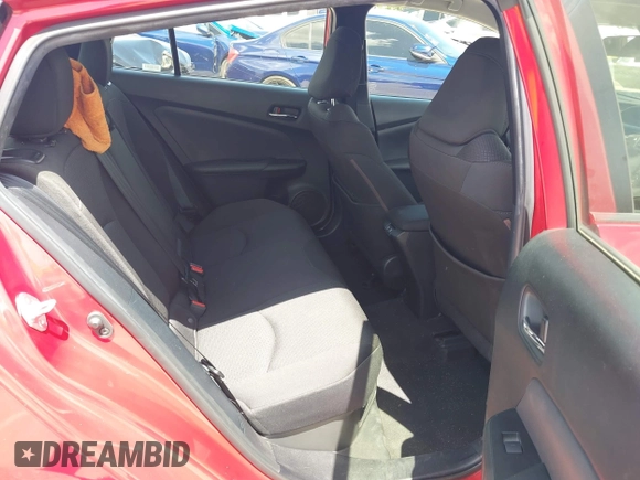 2021 Toyota Prius L Eco with VIN JTDKAMFU4M3145215, listed as a IAAI auction lot 42281566 with 74,220 mi miles and . Bid and sale history available at DreamBid. Image 8.
