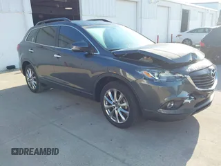 2014 Mazda CX-9 Grand Touring z VIN JM3TB2DA0E0434181, wystawiony jako IAAI lot #42094294 z przebiegiem 78 372 mil mil oraz . Historia ofert i sprzedaży dostępna na DreamBid. Obrazek 1.