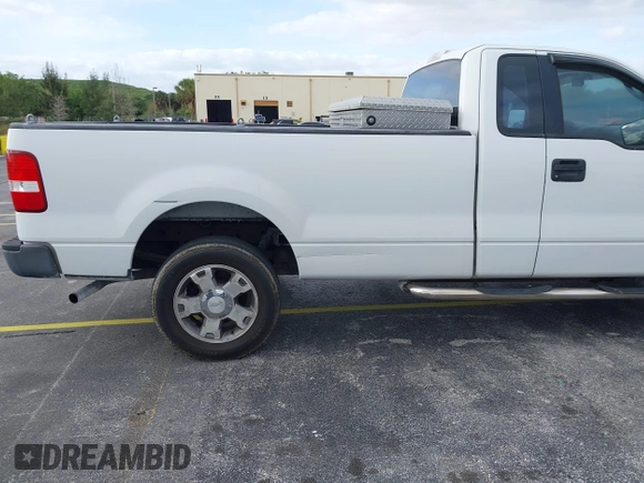 2005 Ford F-150 XL with VIN 1FTRF14W35NB42167, listed as a IAAI auction lot 41990938 with 256,964 mi miles. Bid and sale history available at carsss.com. Image 6.
