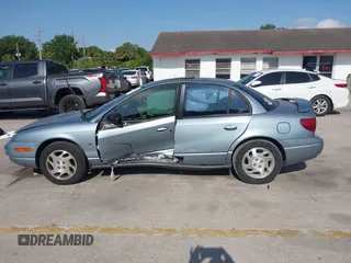 2002 Saturn SL z VIN 1G8ZK54702Z130021, wystawiony jako IAAI lot #42091064 z przebiegiem 68 754 mil mil oraz . Historia ofert i sprzedaży dostępna na DreamBid. Obrazek 14.