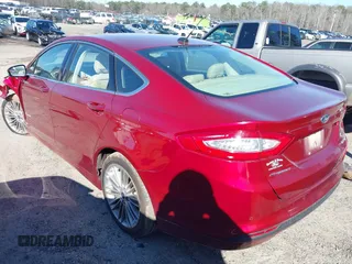 2014 Ford Fusion SE Hybrid with VIN 3FA6P0LU3ER251743, listed as a IAAI auction lot 41625631 with 136,355 mi miles. Bid and sale history available at carsss.com. Image 3.