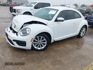 2018 Volkswagen Beetle S with VIN 3VWFD7AT3JM703443, listed as a IAAI auction lot 41437909 with 76,757 mi miles. Bid and sale history available at carsss.com. Image 2.