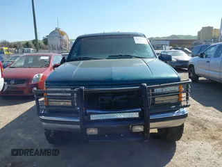 1999 GMC Suburban with VIN 3GKGK26J4XG508566, listed as a IAAI auction lot 41778760 with 1,028,244 mi miles. Bid and sale history available at carsss.com. Image 6.