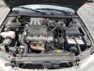 1999 Toyota Camry LE z VIN JT2BF28K6X0215555, wystawiony jako Copart lot #52587985 z przebiegiem 201 225 mil mil oraz Szkoda całkowita • Salvage title. Historia ofert i sprzedaży dostępna na DreamBid. Obrazek 11.