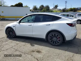 2022 Tesla Model Y Performance с VIN 7SAYGDEF2NF405596, выставлен на аукционе Copart как лот 52868195 с пробегом Не указан миль и Списание • Salvage title. История ставок и продаж доступна на DreamBid. Изображение 2.