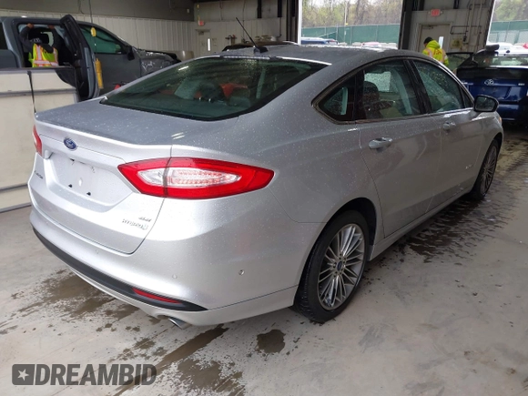 2013 Ford Fusion SE Hybrid with VIN 3FA6P0LU2DR319335, listed as a IAAI auction lot 42007573 with 135,099 mi miles. Bid and sale history available at carsss.com. Image 4.