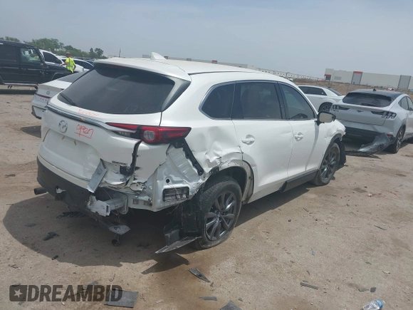 2021 Mazda CX-9 Touring with VIN JM3TCACY9M0526376, listed as a IAAI auction lot 42264478 with 74,671 mi miles and . Bid and sale history available at DreamBid. Image 4.