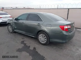 2014 Toyota Camry Hybrid LE with VIN 4T1BD1FK2EU134838, listed as a IAAI auction lot 41912000 with 132,000 mi miles. Bid and sale history available at carsss.com. Image 3.