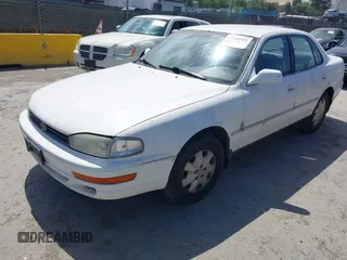 1993 Toyota Camry LE z VIN JT2SK12E0P0143650, wystawiony jako IAAI lot #42345181 z przebiegiem 264 350 mil mil oraz . Historia ofert i sprzedaży dostępna na DreamBid. Obrazek 2.