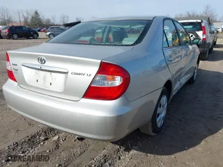 2004 Toyota Camry LE with VIN 4T1BE30K54U828326, listed as a IAAI auction lot 41876818 with 164,876 mi miles. Bid and sale history available at carsss.com. Image 4.