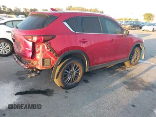 2020 Mazda CX-5 Touring z VIN JM3KFACM1L0855474, wystawiony jako IAAI lot #42004504 z przebiegiem 82 505 mil mil oraz . Historia ofert i sprzedaży dostępna na DreamBid. Obrazek 4.