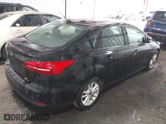 2015 Ford Focus SE with VIN 1FADP3F25FL216205, listed as a IAAI auction lot 42425478 with 124,117 mi miles and . Bid and sale history available at DreamBid. Image 4.