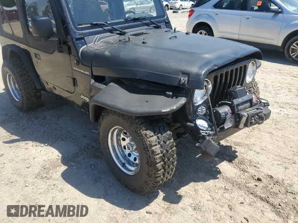 1999 Jeep Wrangler SE with VIN 1J4FY29P3XP408468, listed as a Copart auction lot 55537335 with Not provided miles and Salvage title. Bid and sale history available at DreamBid. Image 9.