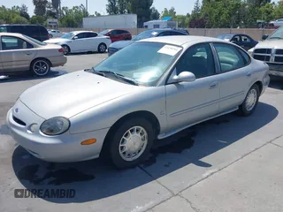 1996 Ford Taurus LX with VIN 1FALP53S5TG199843, listed as a IAAI auction lot 42430761 with 95,984 mi miles and . Bid and sale history available at DreamBid. Image 2.