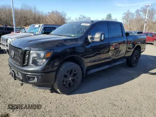 2018 Nissan Titan XD Platinum Reserve with VIN 1N6BA1F4XJN516387, listed as a Copart auction lot 88000895 with 77,492 mi miles and Clean Title. Bid and sale history available at carsss.com. Image 1.