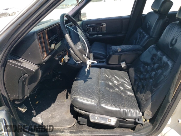 1991 Cadillac Seville z VIN 1G6KS53B9MU824142, wystawiony jako Copart lot #74276264 z przebiegiem 103 517 mil mil oraz Szkody całkowita. Historia ofert i sprzedaży dostępna na DreamBid. Obrazek 7.