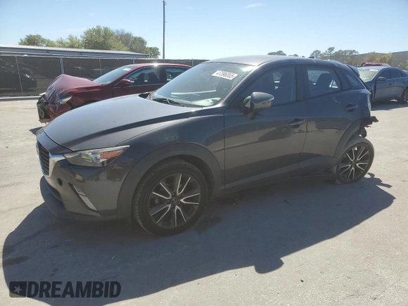 2017 Mazda CX-3 Touring z VIN JM1DKDC73H0172403, wystawiony jako Copart lot #47396355 z przebiegiem 79 865 mil mil oraz Szkoda całkowita • Salvage title. Historia ofert i sprzedaży dostępna na DreamBid. Obrazek 1.