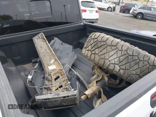 2020 Jeep Gladiator Sport S with VIN 1C6HJTAG9LL194454, listed as a IAAI auction lot 42430339 with 90,461 mi miles and . Bid and sale history available at DreamBid. Image 12.