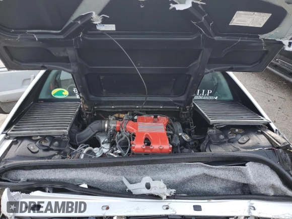 1985 Pontiac Fiero z VIN 1G2PF3795FP228812, wystawiony jako Copart lot #84717324 z przebiegiem 173 310 mil mil oraz Nie do naprawy • Non repairable. Historia ofert i sprzedaży dostępna na DreamBid. Obrazek 11.