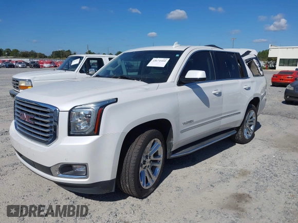 2019 GMC Yukon SLT with VIN 1GKS1BKC9KR332014, listed as a IAAI auction lot 40674460 with 76,545 mi miles. Bid and sale history available at carsss.com. Image 17.