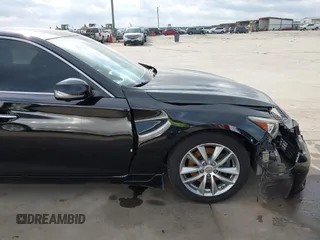 2015 Infiniti Q50 z VIN JN1BV7AP3FM335871, wystawiony jako IAAI lot #41472424 z przebiegiem 127 383 mil mil oraz . Historia ofert i sprzedaży dostępna na DreamBid. Obrazek 18.