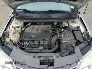 2010 Chrysler Sebring Touring z VIN 1C3CC4FB3AN203543, wystawiony jako Copart lot #57767985 z przebiegiem 152 951 mil mil oraz Szkoda całkowita • Salvage title. Historia ofert i sprzedaży dostępna na DreamBid. Obrazek 11.