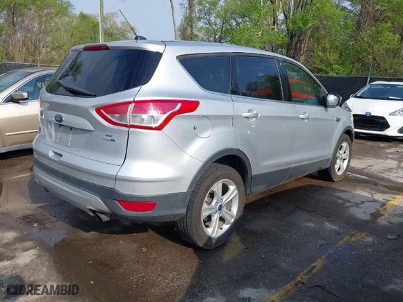 2015 Ford Escape SE with VIN 1FMCU9GX5FUC62439, listed as a IAAI auction lot 42066128 with 137,845 mi miles. Bid and sale history available at carsss.com. Image 4.