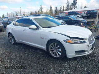 2013 Jaguar XF I4 RWD with VIN SAJWA0ES5DPS80174, listed as a IAAI auction lot 41378775 with 160,497 mi miles. Bid and sale history available at carsss.com. Image 1.