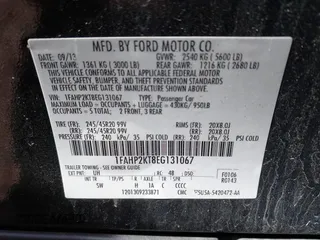 2014 Ford Taurus SHO with VIN 1FAHP2KT8EG131067, listed as a IAAI auction lot 42102086 with 107,822 mi miles. Bid and sale history available at carsss.com. Image 9.