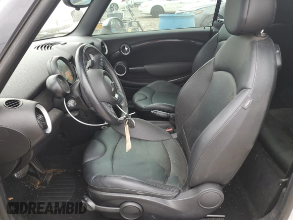 2015 MINI Convertible S with VIN WMWZP3C57F2A91437, listed as a Copart auction lot 53883525 with 28,185 mi miles and Salvage title. Bid and sale history available at DreamBid. Image 7.