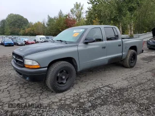 2003 Dodge Dakota Sport with VIN 1D7HL38N63S192308, listed as a Copart auction lot 77494684 with 128,512 mi miles and Salvage Title. Bid and sale history available at carsss.com. Image 1.