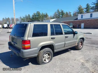 1997 Jeep Grand Cherokee Laredo with VIN 1J4GZ58S7VC713517, listed as a IAAI auction lot 42062214 with 205,533 mi miles. Bid and sale history available at carsss.com. Image 6.